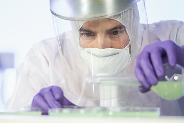 Image showing Scientist working in corona virus vaccine development laboratory research facility.