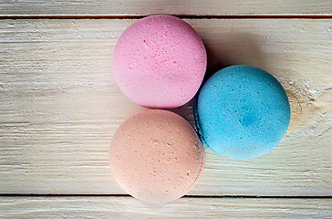Image showing Three macaroons near in white desk