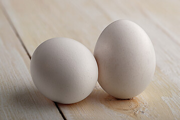 Image showing White eggs on a white table