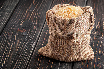Image showing Sack of long rice stands