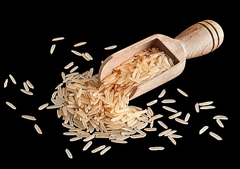 Image showing Rice in a wooden scoop