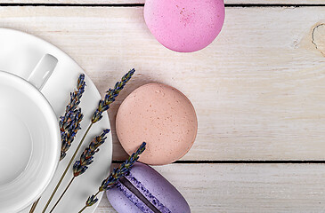 Image showing Macaroons near cup and lavender closeup