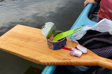 Image showing Canoing trip tuna can eating