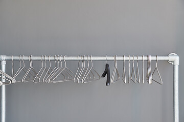 Image showing Empty cloakroom hangers at a canceled evend