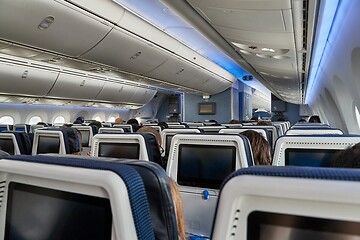 Image showing Plane cabin interior full of passengers