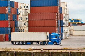 Image showing Container terminal in Rotterdam with truck in front of stack of containers