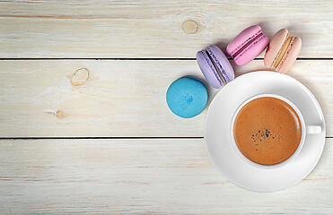 Image showing Macaroons and cup with coffee on top