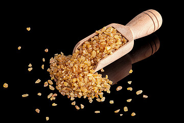 Image showing Dry bulgur in the scoop