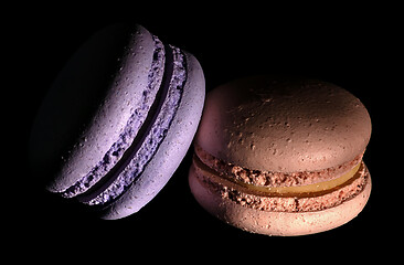 Image showing Two macaroons darkened in black