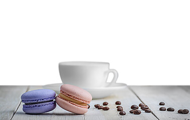 Image showing Two macaroons with cup and coffee grains