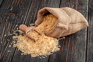 Image showing Sack with rice and spoon lies