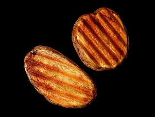 Image showing Two slices of grilled potatoes rotated