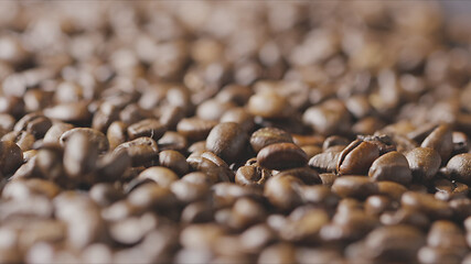 Image showing Macro video falling roasted coffee beans closeup. Slow motion, Full HD video, 240fps, 1080p.