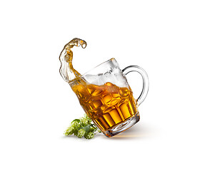 Image showing Glass of beer on wooden table with sea on background