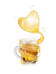Image showing Heart splash of light beer above full glass mug of fresh beverage.