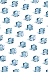 Image showing Creative pattern from ice cubes on a white background.