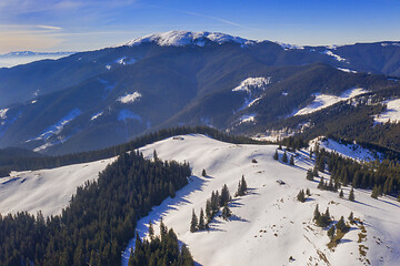 Image showing Mountain winter scene, aerial sunny day view