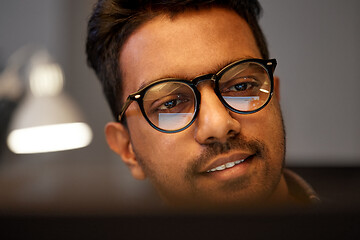 Image showing close up of creative man working at night office