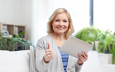 Image showing happy woman with tablet pc showing thumbs up