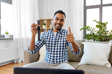 Image showing male blogger recording video review of smart watch