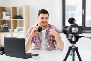 Image showing male blogger with smart speaker videoblogging