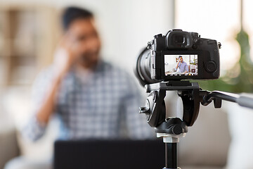 Image showing camera recording video blog of indian male blogger