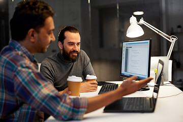 Image showing creative team drinking coffee at night office