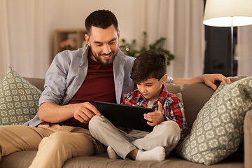 Image showing father and son with tablet pc playing at home