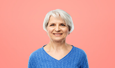 Image showing portrait of smiling senior woman in blue sweater