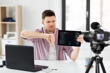 Image showing male blogger with tablet computer videoblogging