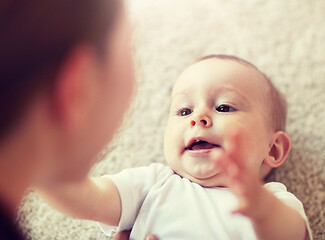 Image showing close up of happy little baby and mother