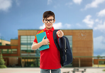 Image showing schoolboy with books and bag over school