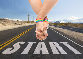 Image showing hands of couple with gay pride rainbow wristbands