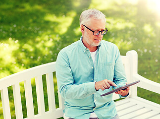 Image showing senior man with tablet pc at summer park