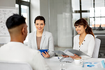 Image showing recruiters having job interview with male employee