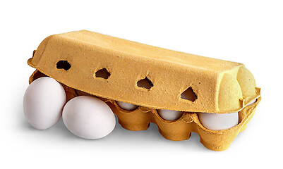 Image showing Closed egg tray and two eggs in front