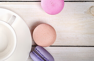 Image showing Macaroons and coffee cup closeup top view