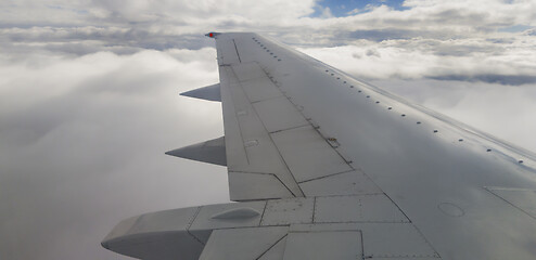Image showing Plane wing and clouds