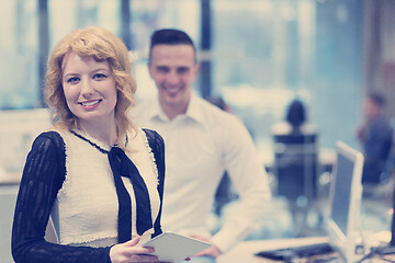 Image showing Business People Working With Tablet in startup office