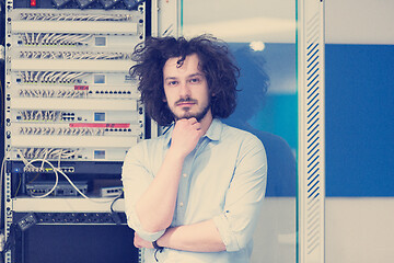 Image showing business man engeneer in datacenter server room