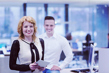 Image showing Business People Working With Tablet in startup office