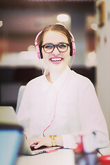 Image showing businesswoman using a laptop in startup office