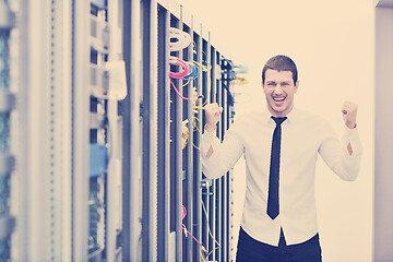 Image showing young engeneer in datacenter server room