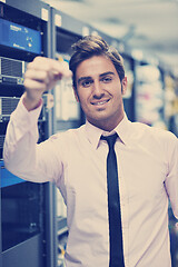 Image showing young it engineer in datacenter server room