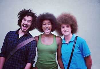 Image showing multiethnic group of happy three friends