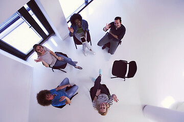 Image showing Multiethnic startup business team on meeting  top view