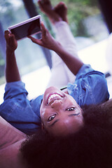 Image showing african american woman at home with digital tablet