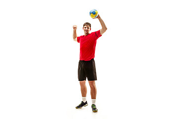 Image showing The one caucasian young man as handball player at studio on white background