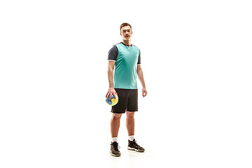 Image showing The one caucasian young man as handball player at studio on white background