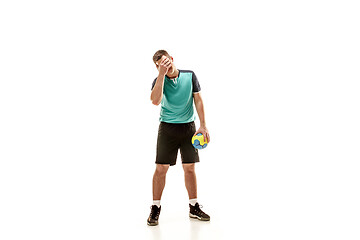 Image showing The one caucasian young man as handball player at studio on white background